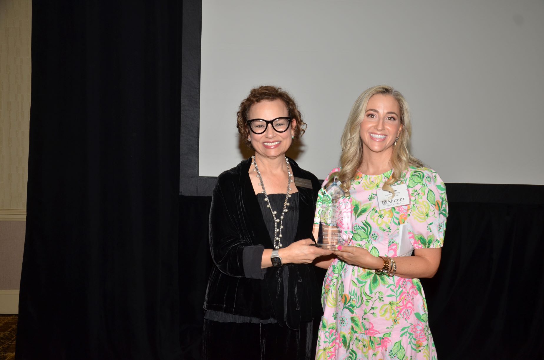 an alumni receiving an awward